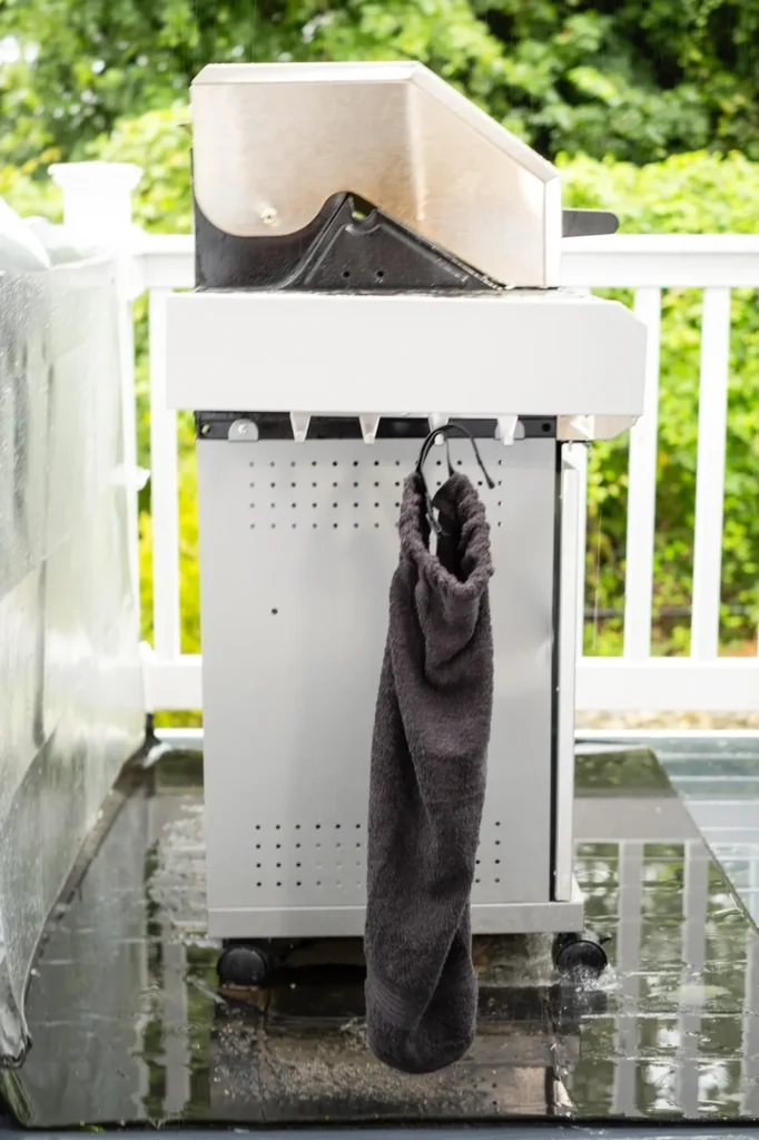 A towel hanging on the side of a white box.